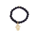 HAMSA FILIGRANA  Y ONIX DORADAS